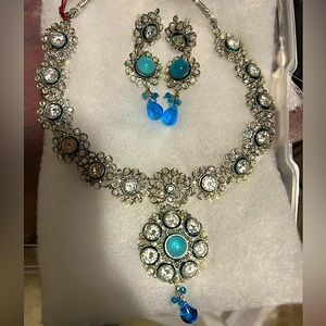 Indian necklace with earrings. It’s brand new.